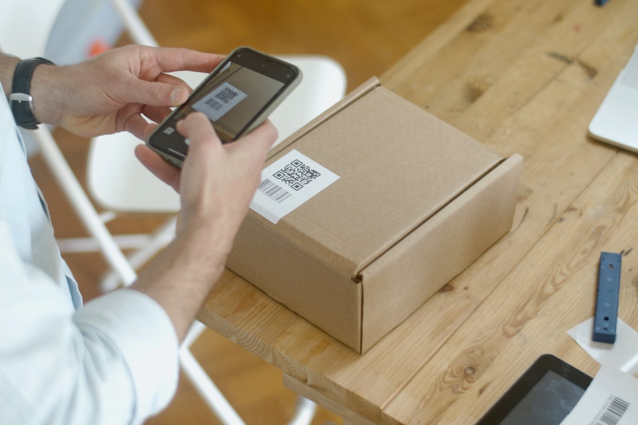 A smartphone to scan a QR code on a label in an online store setting.